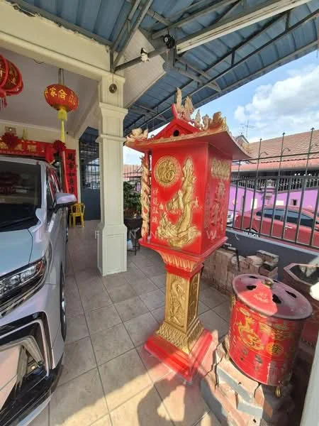 Exterior type: linked terrace house; features: red decorative altar, grey tiled roof, white columns, paved flooring, car parked in driveway, brick wall, outdoor lighting, decorative lanterns, fenced balcony, surrounding residential buildings; style: traditional.