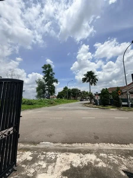 Exterior features: open road, greenery on both sides, paved road, street signs visible, light traffic, cloudy sky, palm trees, tall trees.
