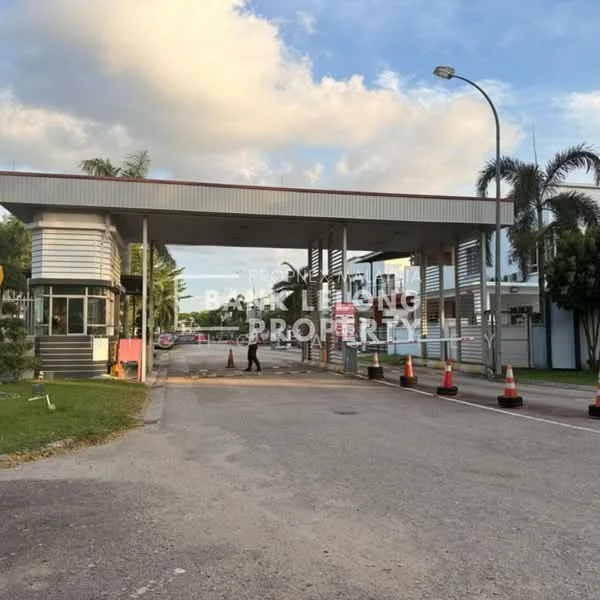 Exterior type: main entrance gate; features: guard house at entrance, security booth, traffic cones, paved road, surrounded by greenery, street lighting, signage, gated entry; style: modern.