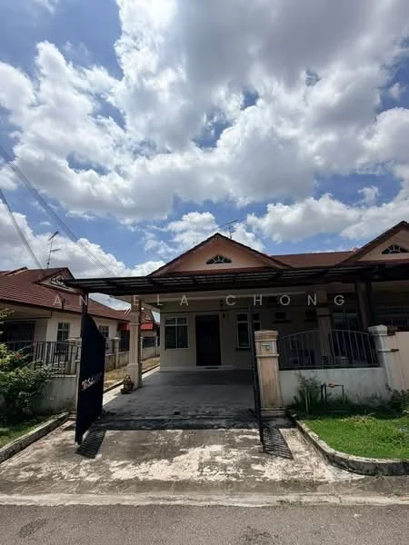 Exterior type: semi-detached house; features: red tile roof, cream painted facade, front porch with awning, driveway with concrete surface, manicured lawn, fence with gate, two-storey structure, surrounded by greenery; style: traditional.