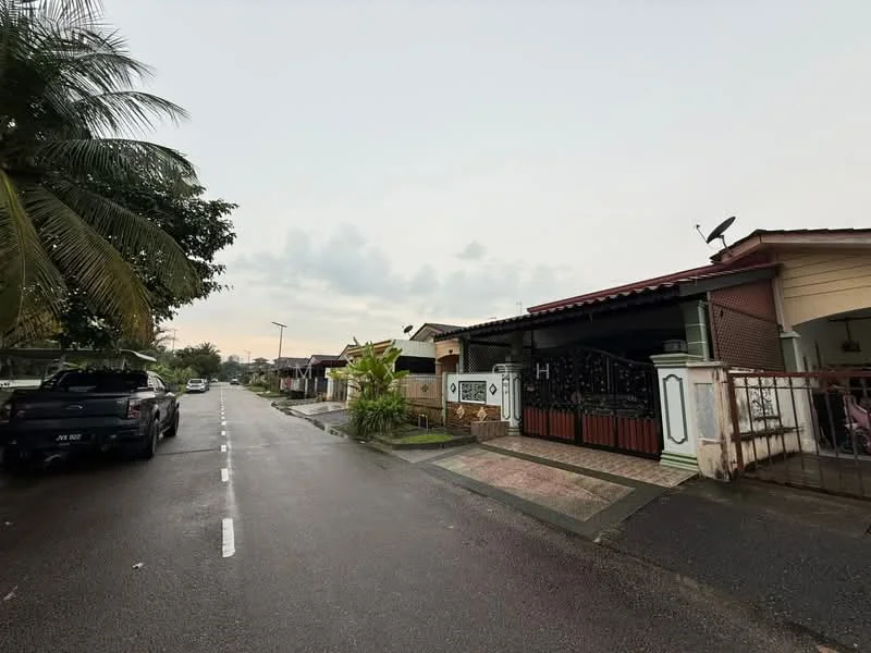 Exterior type: semi-detached house; features: single-storey, red tiled roof, brick facade, front porch with gate, manicured lawn, paved walkway, satellite dish on roof, surrounded by palm trees, driveway with interlocking pavers; style: traditional.