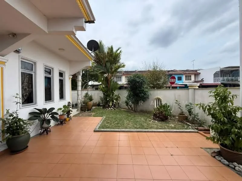Exterior type: detached bungalow; features: tiled patio flooring, manicured lawn, garden area with plants, potted plants, fence surrounding the garden, satellite dish on the roof, decorative stone pathway, wall with decorative elements; style: modern.