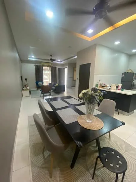 Dining features: black dining table, 4 upholstered dining chairs, round placemat, area rug with circular pattern, recessed downlights, grey painted walls, white ceiling, ceiling fan, wall-mounted TV in living area, open layout to living room, kitchen visible in background, large window with curtains; style: modern. Living features: sofa in dark color, coffee table, decorative cushions, floor lamp, large window with curtains; style: modern. Kitchen features: black refrigerator, kitchen countertop, kitchen cabinets, stainless-steel sink, kitchen appliances visible; style: modern.