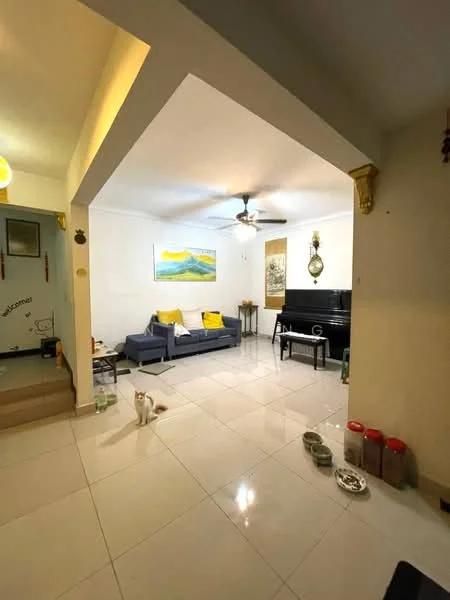 Living features: grey fabric sofa, yellow accent cushions, white walls, recessed downlights, ceiling fan, marble tile flooring, decorative wall art, piano, small side table, cat food bowls, pet food containers; style: modern.