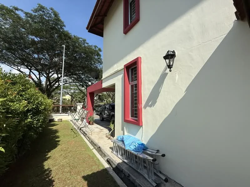 Exterior type: detached bungalow; features: white painted facade, red window frames, sloped roof with tiles, landscaped garden with grass, stone-paved walkway, outdoor seating area with chairs, wall-mounted outdoor light, car parked in driveway, mature trees in background; style: traditional.
