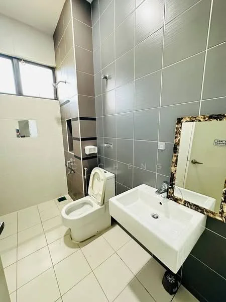 Bathroom features: white ceramic toilet, single-sink vanity with rectangular basin, chrome basin mixer faucet, framed mirror, shower area with wall-mounted shower head, grey tiled walls, white tiled flooring, toilet paper holder, window for natural light; style: modern.