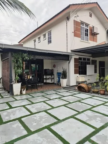 Exterior type: semi-detached house; features: paved stone walkway, manicured lawn, outdoor dining area with table and chairs, air conditioning unit on wall, large windows, garden plants in pots, covered patio area, exterior wall with cream paint and brown accents; style: modern.