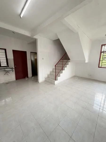Room features: white painted walls, white tiled flooring, staircase with red railing, large windows with red frames, ceiling lights, open layout, kitchenette area visible, no visible furniture; style: minimalist.