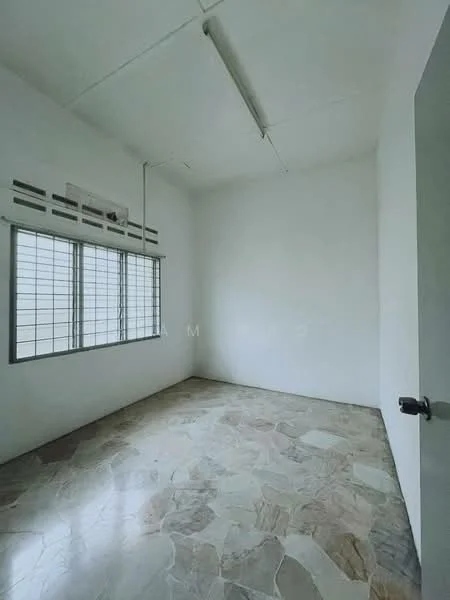 Room features: white painted walls, exposed ceiling, large windows with metal grilles, natural light from windows, stone flooring, no visible furniture, minimal decor, high ceiling; style: minimalist.