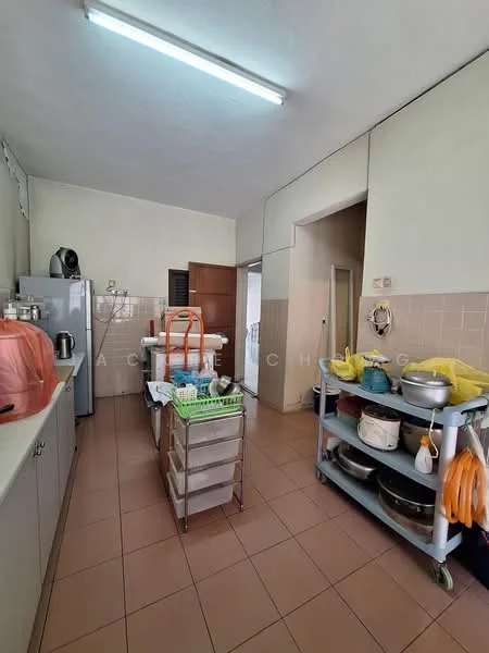 Kitchen features: white cabinetry, grey countertop, stainless-steel fridge, freestanding oven, double-basin sink, chrome faucet, tile backsplash, ceramic tile flooring, overhead fluorescent lighting, kitchen island with storage, open shelving, various cooking utensils, dish rack, stacked pots and pans.
