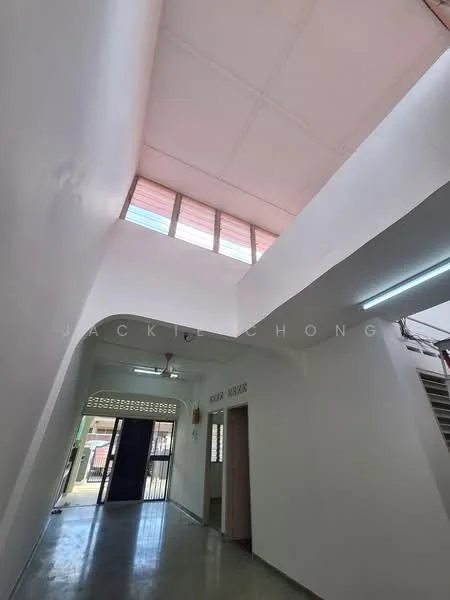 Room features: white painted walls, grey tiled flooring, dropped ceiling, skylight, doorway leading to another room, window with colored glass, light fixture, open space layout; style: modern.
