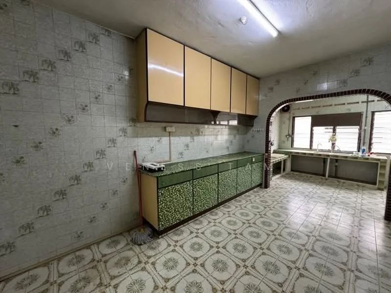 Kitchen features: green cabinetry with floral pattern, yellow upper cabinets, white tiled walls with floral pattern, ceramic tile flooring with geometric pattern, window with natural light, open countertop space, sink area, exposed ceiling light fixture; style: retro.