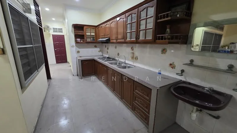 Kitchen features: brown wooden cabinetry, white countertop, double-bowl stainless-steel sink, chrome pull-down faucet, built-in oven, freestanding range oven, ceramic tile flooring, wall-mounted mirror, white tiled backsplash, decorative wall tiles, window with metal grille, wall-mounted storage shelves; style: traditional.