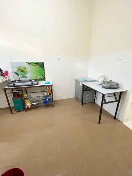 Kitchen features: white tiled walls, brown tiled flooring, stainless-steel gas stove, kitchen countertop, metal shelving unit, refrigerator, sink, kitchen utensils, decorative wall art with flowers.