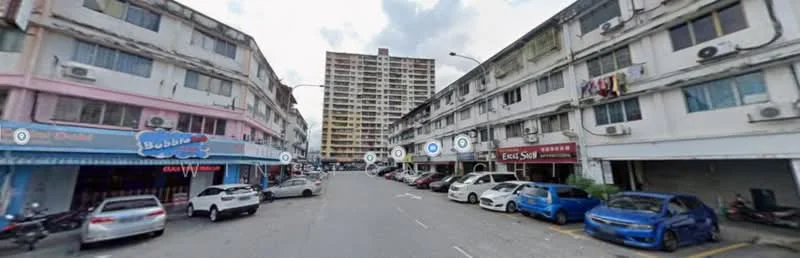 Exterior type: shophouse; features: 3-storey shophouse, mixed-use commercial and residential, balconies on upper floors, air conditioning units visible, street parking, signage for businesses, pedestrian walkway, surrounding low-rise buildings, urban setting, multiple vehicles parked; style: traditional.