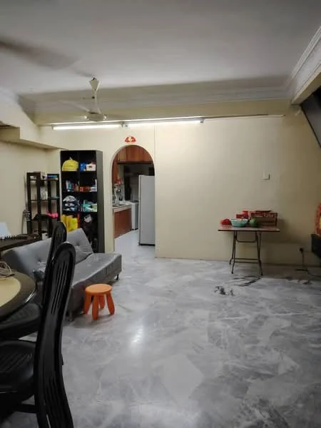 Living features: marble flooring, cream painted walls, 5-blade ceiling fan, sofa, dining table, stool, open layout to kitchen, arched doorway to kitchen, shelves with colorful storage, light fixtures on ceiling. Kitchen features: kitchen cabinets, refrigerator, cooking area, countertop, open layout to living room.