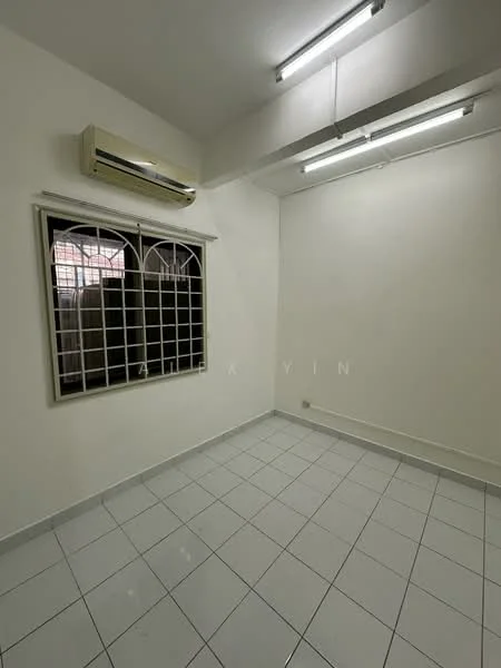 Room features: white painted walls, white tiled flooring, 1 wall-mounted split AC, 2 fluorescent ceiling lights, grilled window, window with white frame.