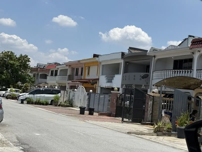 Exterior type: linked terrace house; features: two-storey houses, white painted facade, balconies with railings, gated entrance, driveway with interlocking pavers, manicured landscaping, car porch, front yard with plants, roof overhang, varied facade colors, street view, surrounded by greenery; style: modern.