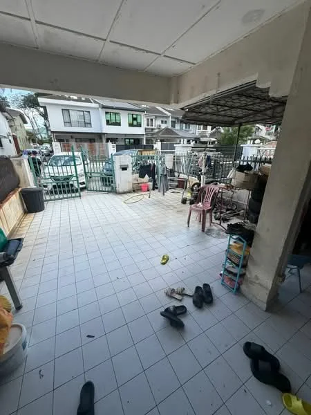 Room features: tiled flooring, open outdoor space, fenced area, clothes drying area, plastic chairs, plastic storage rack, slippers on the floor, visible vehicles outside; view: street.