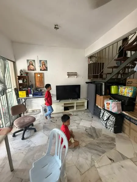 Living features: marble flooring, white painted walls, ceiling fan, wall-mounted TV, TV console, freestanding chair, stacked boxes, sliding glass door, open shelving, decorative artwork, staircase, area rug.