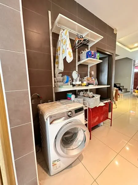 Laundry features: front-load washing machine, open shelving above washer, white storage baskets, red metal storage unit, grey tiled walls, white tiled flooring, hanging rod for clothes, various cleaning supplies; style: modern.