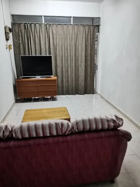 Living features: 3-seater fabric sofa in pink with striped cushions, wooden TV console, flat-screen TV, light-colored tiled flooring, cream painted walls, floor-to-ceiling curtains in brown, coffee table, window with natural light.
