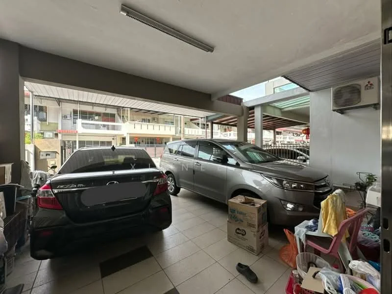 Exterior type: car porch; features: two parked cars, tiled flooring, covered area, storage boxes, plastic chairs, wall-mounted air conditioning unit, open access to street, surrounding residential buildings; style: modern.