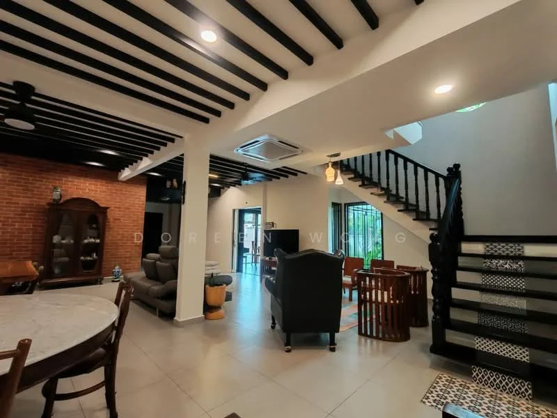 Living features: black wooden ceiling beams, white painted walls, grey tile flooring, 5-blade ceiling fan, sofa in grey fabric, wooden coffee table, dining table with wooden chairs, brick accent wall, staircase with black railing, large windows with natural light; style: modern. Dining features: round dining table, wooden dining chairs, decorative vase on table; style: modern.