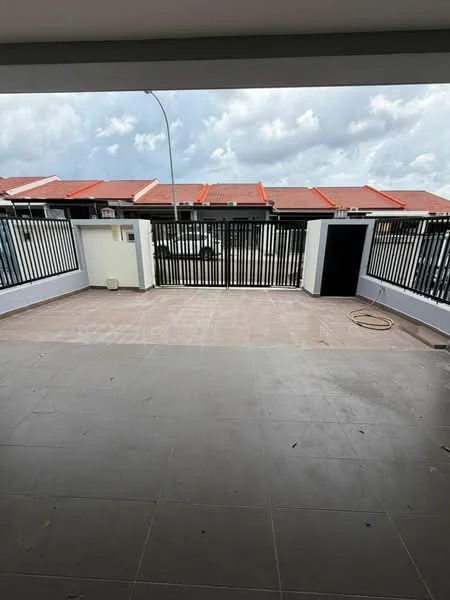 Exterior type: linked terrace house; features: paved flooring, black metal railing, fenced perimeter, roof overhang, street view, adjacent houses with red tiled roofs, outdoor space, light fixture on wall; style: modern.