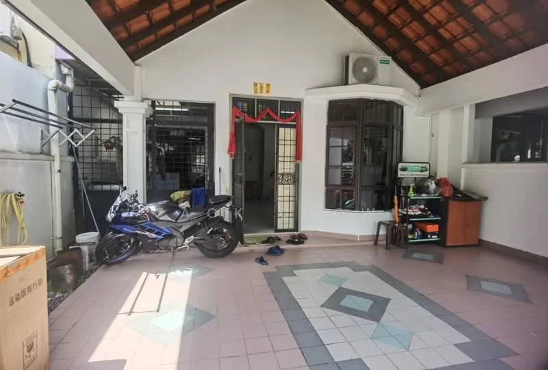 Room features: tiled flooring with geometric pattern, exposed wooden beams on ceiling, double-door entrance with glass panels, decorative wall with red ribbons, motorcycle parked, shoe rack, open space layout, window with grid design, wall-mounted fan; style: traditional.