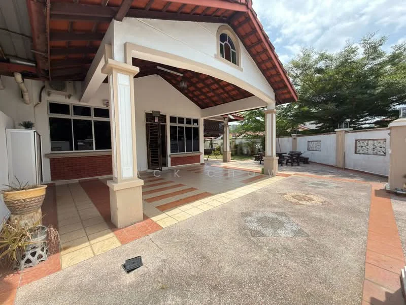 Exterior type: detached bungalow; features: red tiled roof, white painted facade, large windows, paved driveway, manicured garden area, outdoor seating area, decorative wall panels, covered porch, open outdoor space, surrounding greenery; style: modern.