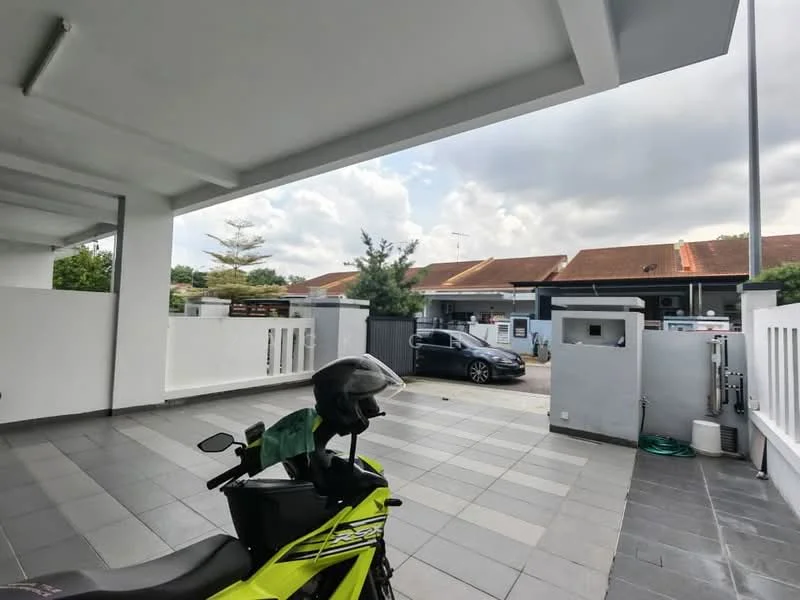 Exterior type: linked terrace house; features: paved driveway, white painted walls, covered car porch, manicured landscaping, visible neighboring houses, parking space for vehicles, security gate, outdoor lighting, garden area, concrete fence; style: modern.