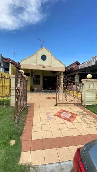 Exterior type: detached bungalow; features: yellow painted facade, gabled roof, decorative circular window, iron gate, tiled walkway, manicured lawn, surrounding fencing, driveway, outdoor lighting, satellite dish, front porch; style: modern.