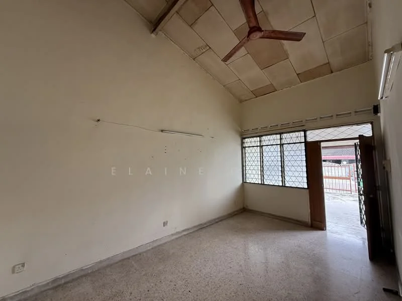 Room features: plain white walls, high ceiling, ceiling fan, large windows with metal grilles, light-colored flooring, wooden door, no visible furniture, minimal decor; style: minimalist.