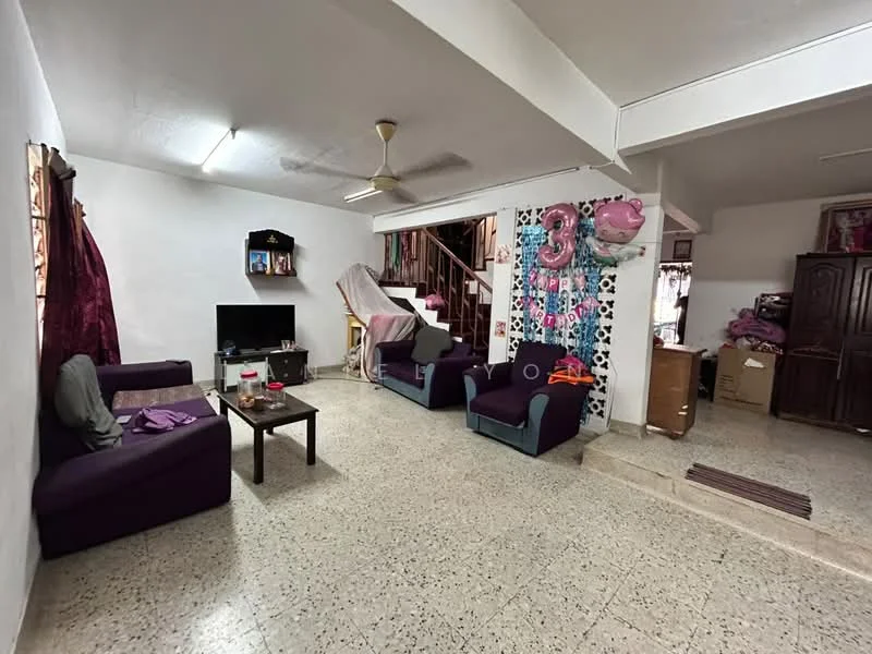 Living features: purple fabric sofa, 2 purple armchairs, wooden coffee table, wall-mounted TV, ceiling fan, textured flooring, white painted walls, decorative wall with balloons, staircase in background, box storage, curtains, decorative wall panel.