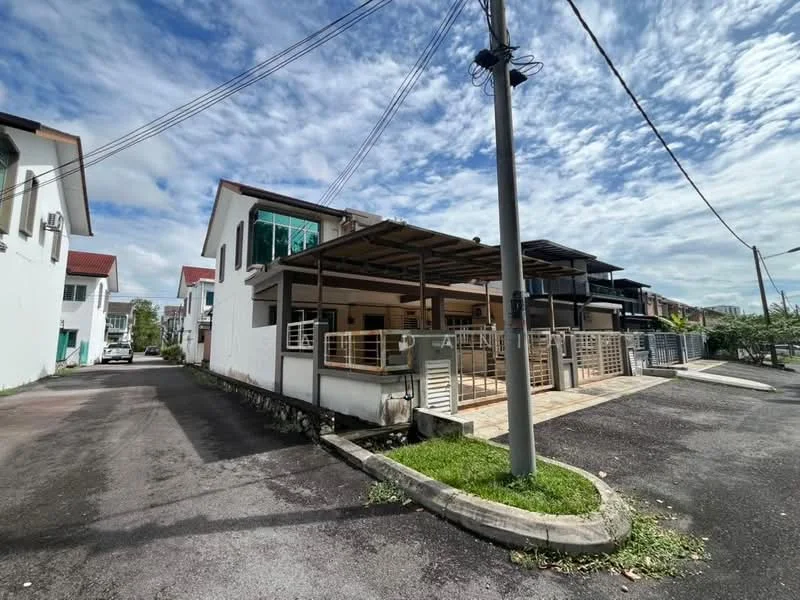 Exterior type: linked terrace house; features: white painted facade, flat roof, single-storey, car porch with awning, manicured lawn, paved walkway, surrounded by mature greenery, visible power lines, driveway with interlocking pavers; style: modern.