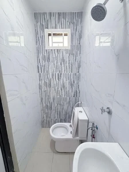 Bathroom features: white tiled walls, grey marble accent wall, white floor tiles, one-piece toilet, chrome basin mixer faucet, shower head, window for natural light, built-in shower area; style: modern.