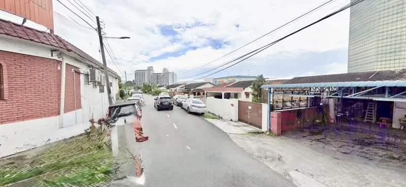 Exterior type: linked terrace house; features: red brick facade, single-storey, paved road, street view, surrounded by residential buildings, visible parking spaces, utility poles, overhead power lines; style: traditional.
