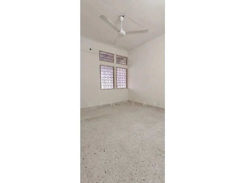 Room features: plain white walls, cement flooring, ceiling fan, two windows with decorative grilles, natural light from windows; style: minimalist.