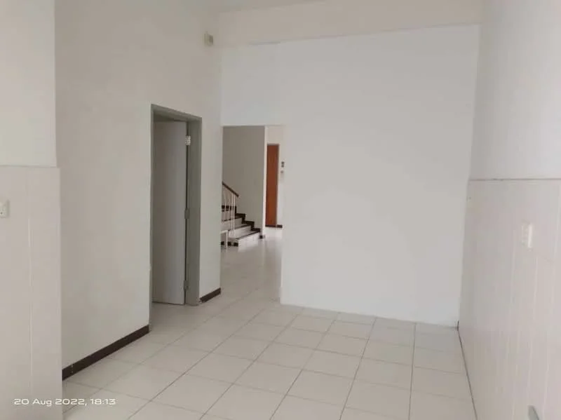 Room features: white painted walls, tile flooring, doorway leading to another room, staircase visible in the background, high ceiling, neutral color scheme; style: modern.