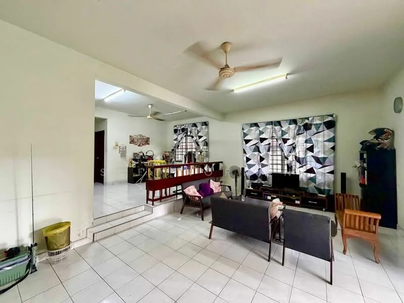 Living features: white painted walls, ceramic tile flooring, 5-blade ceiling fan, floor-to-ceiling windows with patterned curtains, sofa with dark upholstery, wooden armchair, TV console, wall-mounted TV, decorative items on shelves, open layout to kitchen, dining area visible in background, light fixtures on ceiling; style: modern.