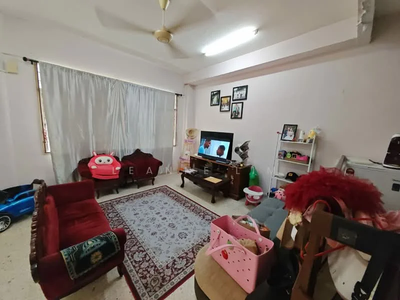 Living features: 3-seater fabric sofa in red, area rug with floral pattern, wall-mounted TV, wooden TV console, ceiling fan, curtains, decorative wall frames, children's toys, plush chair, side table, decorative items on shelves.