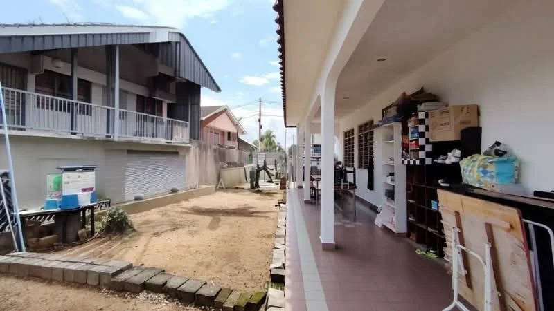 Room features: tiled flooring, white painted walls, open space layout, windows with no visible treatments, exposed ceiling, bar counter, storage shelves, outdoor view, adjacent garden area; style: modern; view: garden.