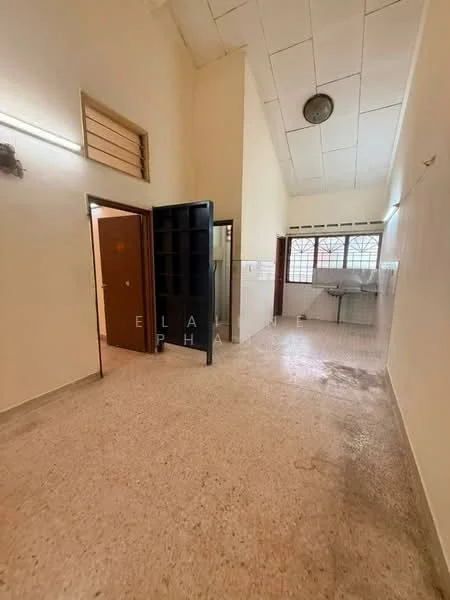 Room features: high ceiling, white painted walls, terrazzo flooring, large window with grid pattern, wooden door, black shelving unit, light fixture on ceiling, open layout.