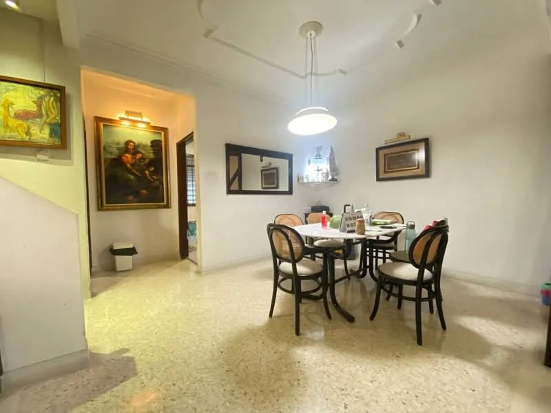 Dining features: round dining table, 4 upholstered dining chairs, pendant light, white painted walls, polished floor tiles, framed artwork on wall, mirror on wall, decorative wall sconce, doorway leading to hallway, window with natural light; style: traditional. Room features: white painted walls, polished floor tiles, doorway leading to another room, light fixture on ceiling.