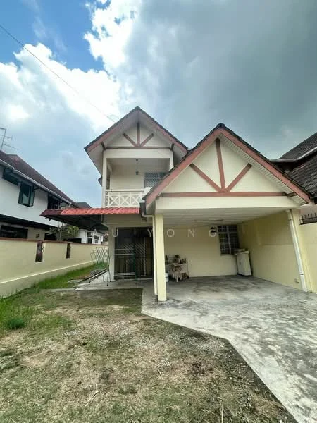 Exterior type: detached bungalow; features: pitched tile roof, cream painted facade, exposed wooden beams, front porch with railing, concrete driveway, manicured lawn, single-storey, two-storey structure, surrounded by greenery; style: traditional.