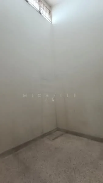 Room features: white painted walls, concrete flooring, small window, corner space.