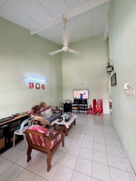 Living features: light green painted walls, white tiled flooring, high ceiling, 5-blade ceiling fan, sofa with floral upholstery, wooden coffee table, TV console, wall-mounted TV, decorative wall lantern, area rug, study desk, plastic chair; style: modern.