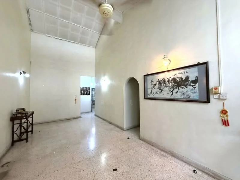 Room features: white painted walls, polished concrete flooring, high ceiling, ceiling fan, wall-mounted lighting, arched doorway, framed artwork on wall, decorative wall hanging; style: minimalist.