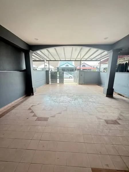 Exterior type: car porch; features: covered car porch, tiled flooring, grey painted walls, sliding gate, open space, roof with support beams, natural light from overhead, surrounding residential area; style: modern.